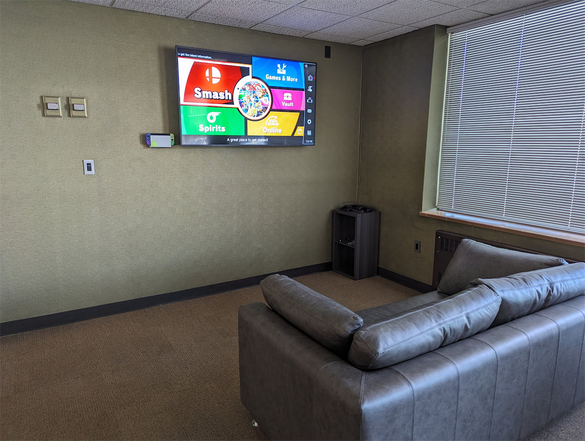 Three gaming computer setups with RGB lights glowing from them