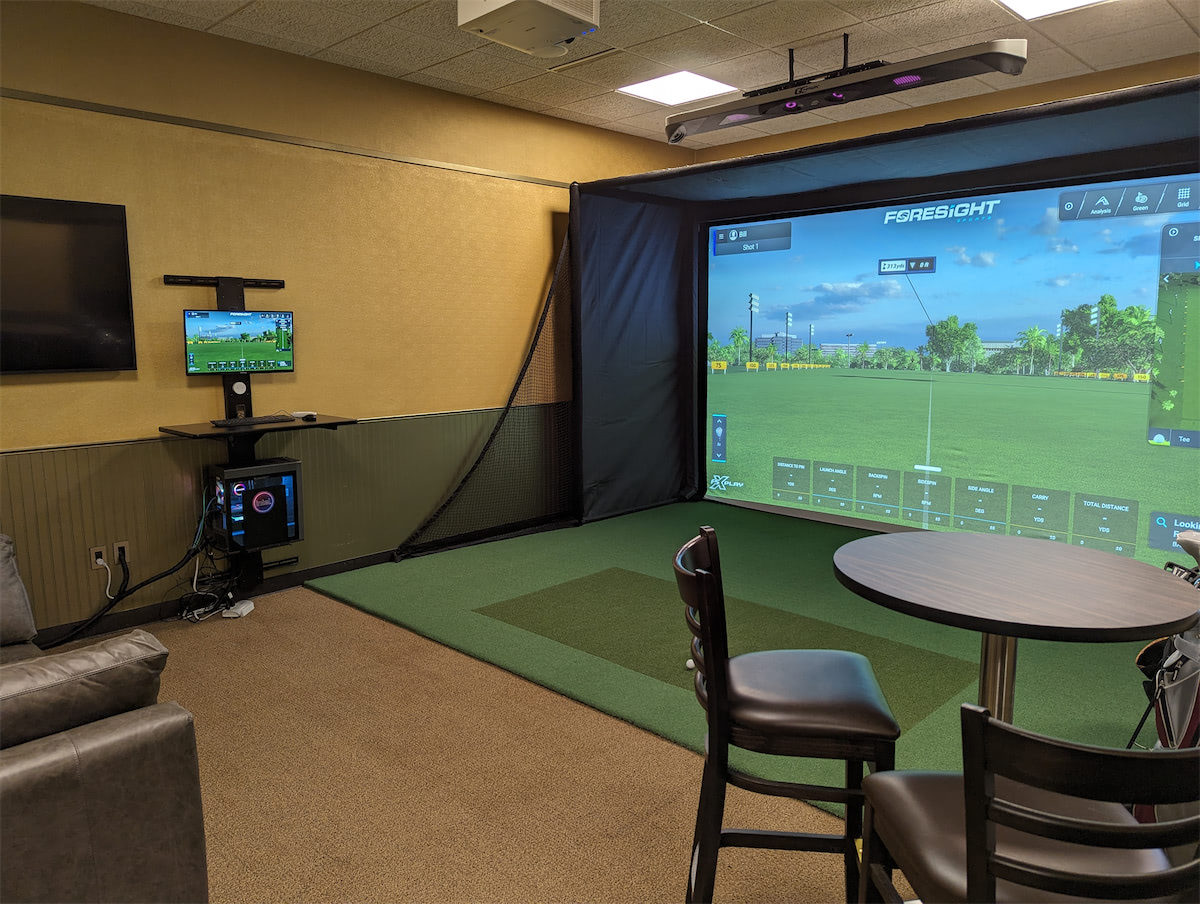 Three gaming computer setups with RGB lights glowing from them