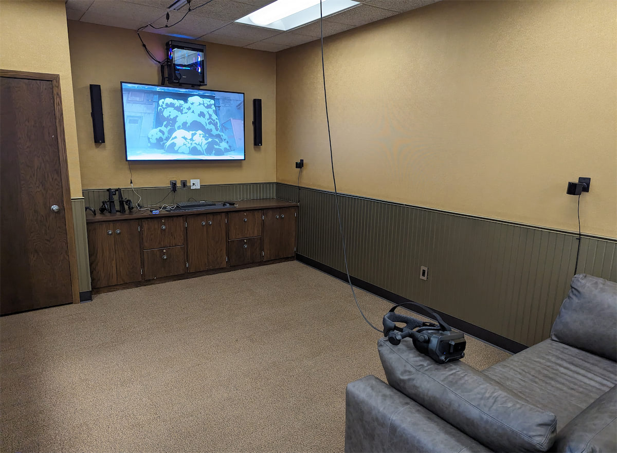 Three gaming computer setups with RGB lights glowing from them